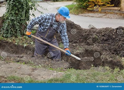 Construction Worker Digging Trench Using Shovel Stock Image Image Of