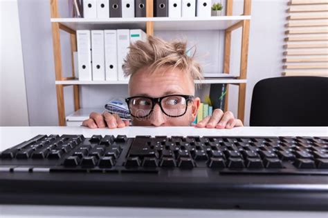 Funny Businessman Hiding Behind Desk Stock Photo Image Of Office