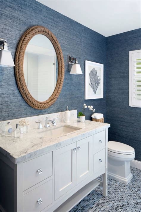 The Textured Blue Grasscloth Wallpaper And Rope Framed Mirror Give Off
