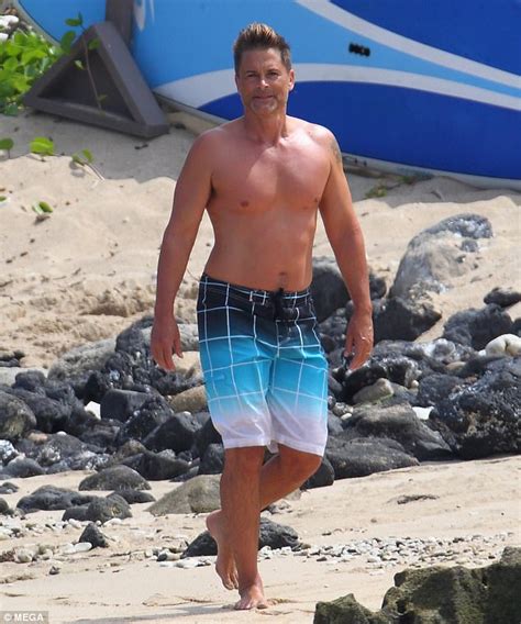 rob lowe reveals toned and tanned physique in swim trunks daily mail online