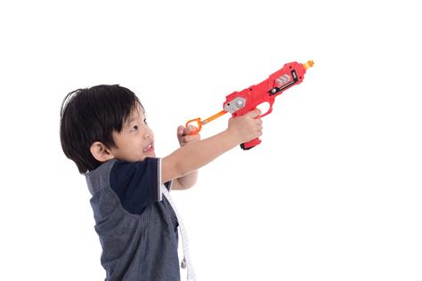 Cute Asian Boy Playing Toy Gun Dart Dudes