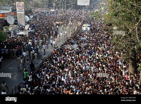 People gather during the funeral of Indian actress Sridevi in Mumbai