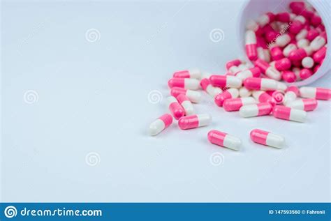 Pink White Capsule Pills Spread Out Of Drug Bottle Antipsychotic Drug
