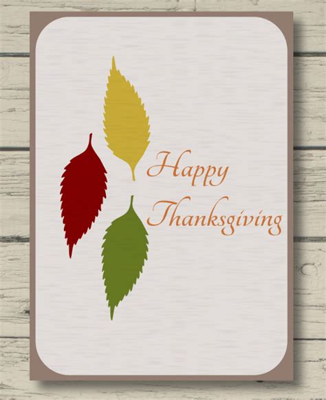 A Happy Thanksgiving Card With Three Leaves