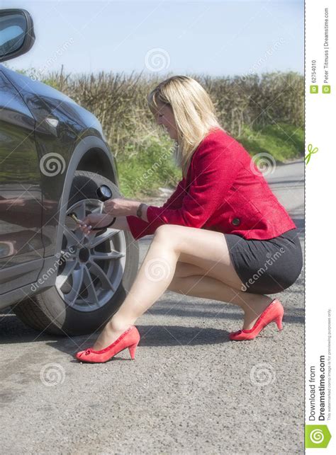 Motorist Checking Tire Pressure Of A Car Stock Photo Image Of