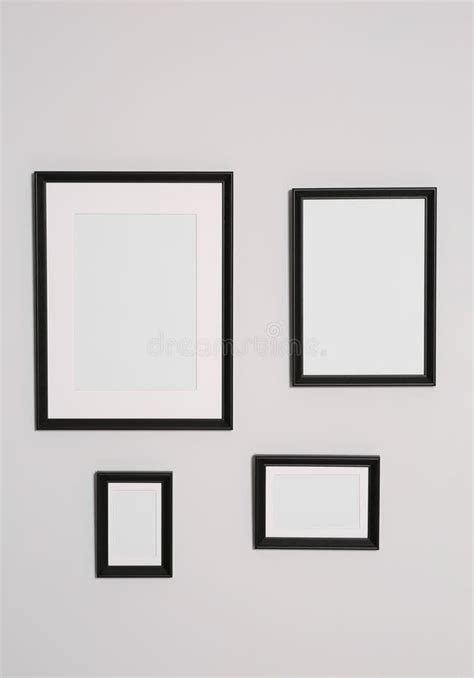 Different Empty Frames Hanging On White Wall Stock Image Image Of