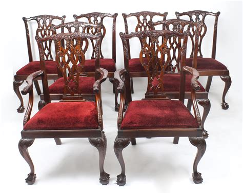 English chippendale mahogany dining chairs, early 19th century, set of 8, comprising two arm chairs and six side chairs, carved crests over pierced vasiform splats, damask pattern upholstery. Mahogany dining chairs | Ref. no. 09276 | Regent Antiques