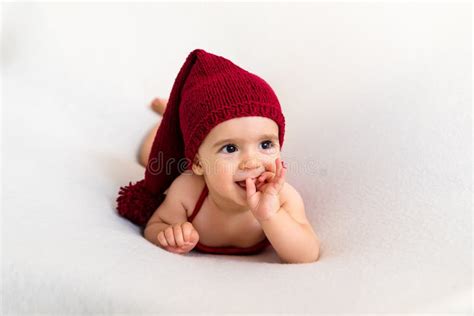 Cute Newborn Baby In The Red Hat Happy Baby On A White Background