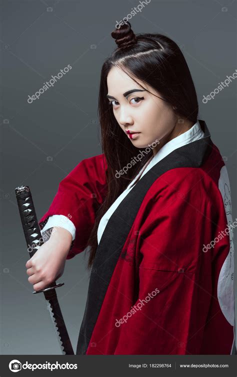 Young Asian Woman Kimono Holding Katana Looking Camera Isolated Grey