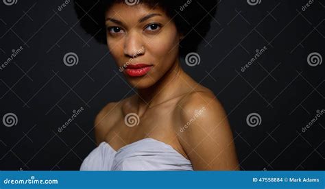 Attractive Black Woman Wearing Elegant Gown Looking At Camera Stock