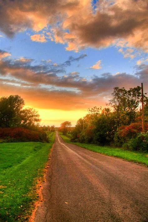 Country Road At Sunset Country Roads Beautiful Nature Beautiful Roads