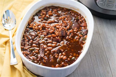Baked beans aren't just canned beans but beans usually prepared (canned) with onions, molasses, bacon and brown sugar. Pressure Cooker Baked Beans - Southern Style | The Foodie Eats