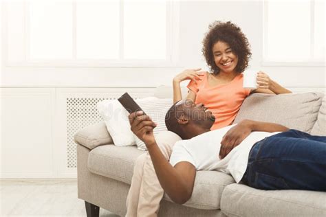 Happy African American Couple Watching Tv At Home Stock Image Image