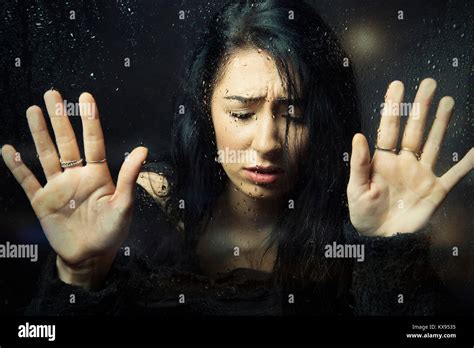 Distressed Sad Depressed Unhappy Woman Hands Pressed Against Window
