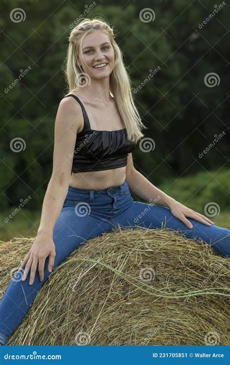 a lovely blonde model poses outdoors in a farm environment stock image image of caucasian