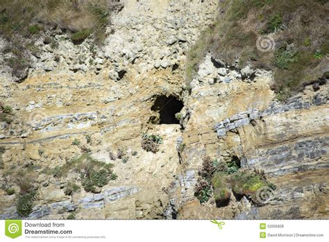 Cliff And Cave Entrance At Caves Beach Stock Image
