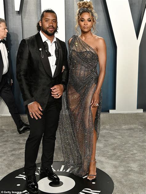 Ciara Displays Bump In See Through Gown As She Poses With Russell