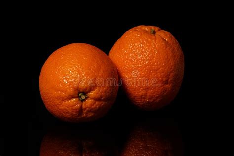 Oranges Fruit On A Black Background With Reflection Stock Photo Image