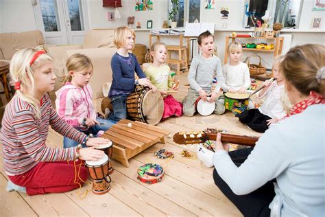 A Group Of Children Learning To Play Musical Instruments Stock Image