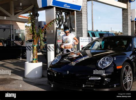 Katie Price Aka Jordan Seen Filling Up Her Porsche At A Petrol Station