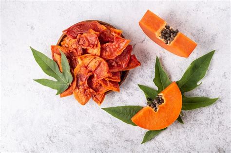 Premium Photo Dried Papaya Slices On White Background Top View