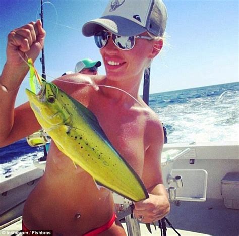 Bizarre Trend For Women Holding Their Catch Of The Day Across Their Cleavage Daily Mail Online
