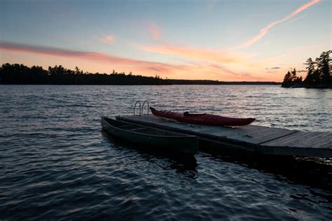 premium photo boats at a dock kenora lake of the woods ontario canada