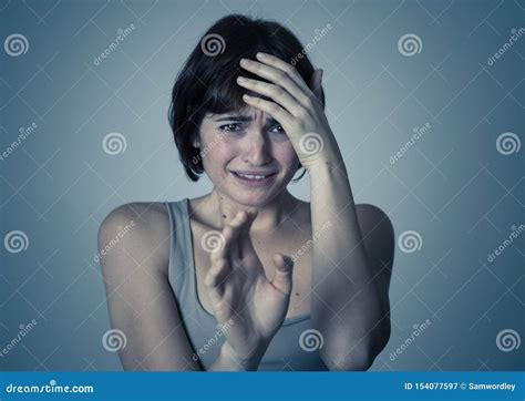 Portrait Of A Young Attractive Woman Looking Scared And Shockedhuman