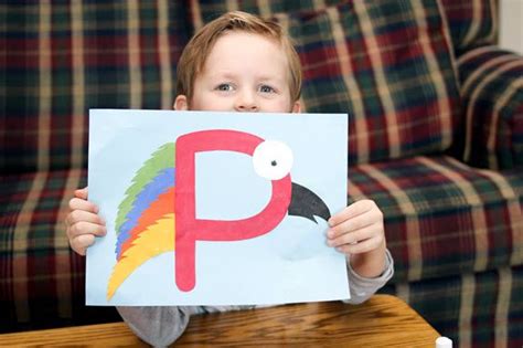 Boy Holding Up His Finished Letter P Craft Letter P Crafts Alphabet