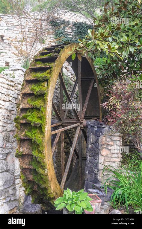 Wheel Of An Old Water Mill Overgrown With With Moss Stock Photo Alamy