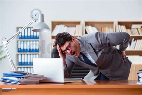 Businessman Feeling Pain In The Office Stock Image Colourbox