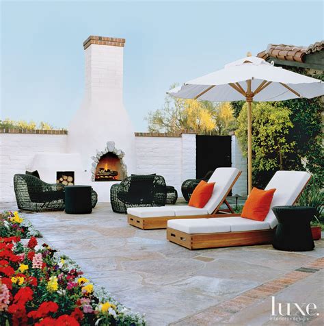 Contemporary White Outdoor Sitting Area With Adobe Fireplace Luxe