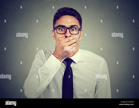 Shocked Man Covering His Mouth With Hand Stock Photo Alamy