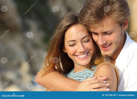 Happy Couple Flirting During Their First Date Outdoors Stock Image Image Of Embracing