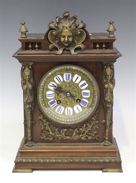 A Late 19th Century French Brass Mounted Walnut Mantel Clock With Eight
