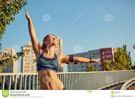 Girl Runner Happy After Jogging Raised Her Hands Up Stock Image