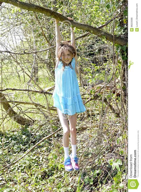 Girl Climbing On Tree Stock Photo Image Of Courage