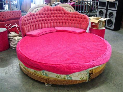 A customer signature is required. Romantic round bed with pink tufted bed board