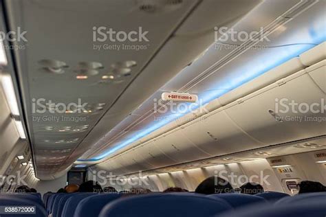 Emergency Exit Row In Airplane Exit Sign In Thai Language Stock Photo