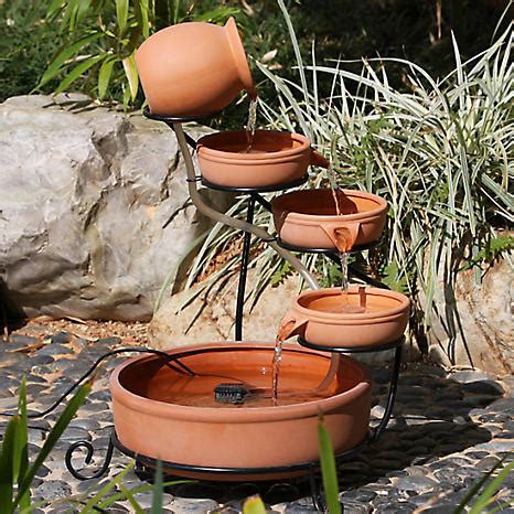 The pv array powers a low voltage dc pump. Solar Powered Terracotta Cascade Garden Water Feature ...