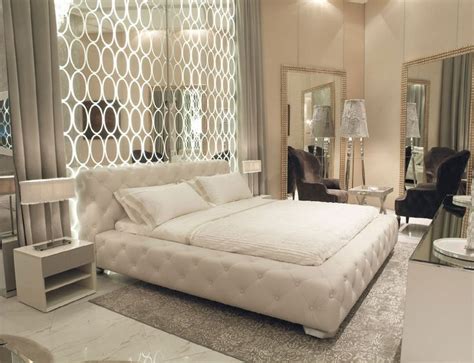 Art Deco Master Bedroom With High Ceiling And Simple Marble Tile Floors