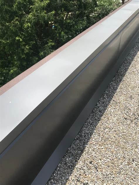 Sheet Metal Coping At Parapet Wall On Commercial Property In