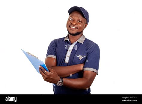 young delivery man standing in blue uniform standing and holding a