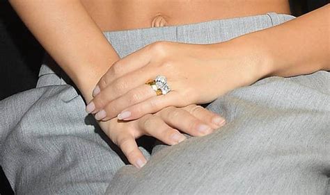 Shiny gold bands hold the stones in place and augment their sparkle. Emily Ratajkowski in pictures: Model shows off huge ...