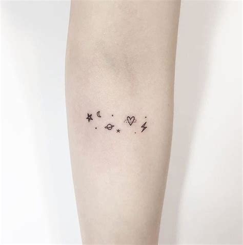 Minimalist Space Tattoo On The Forearm
