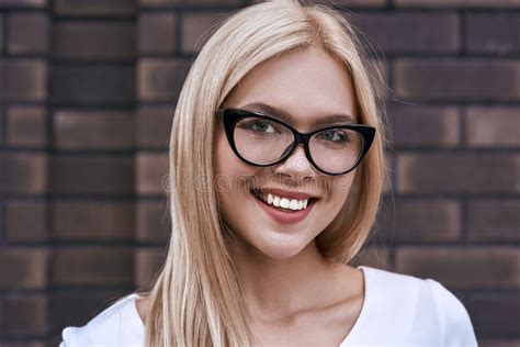 Portrait Of Smiling Blonde Woman In Glasses Stock Photo Image Of Face