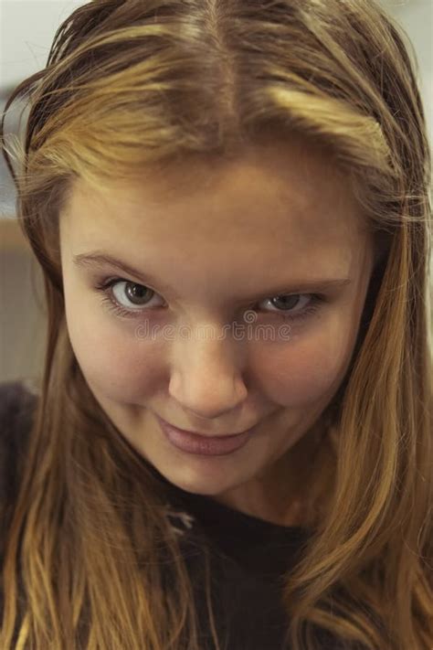 portrait of a teenage girl of european appearance with blond hair