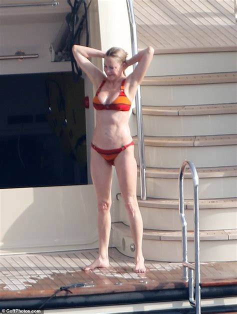 Melanie Griffith 61 Sizzles In An Orange Striped Bikini Aboard Luxury