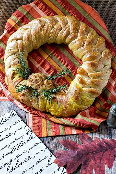 Serve sliced thin with cream cheese. This Thanksgiving wreath braided bread centerpiece recipe ...