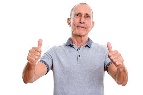 Studio Shot Of Senior Man Giving Thumbs Up Stock Image Image Of Gesture White